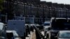 FILE - Cars wait in traffic on the A4, a main road in London, April 22, 2021. 