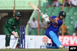 India's Ishan Kishan plays a shot during the third and final one-day international (ODI) cricket match between Bangladesh and India at the Zahur Ahmed Chowdhury Stadium in Chittagong on December 10, 2022. (Photo by Munir uz ZAMAN / AFP)