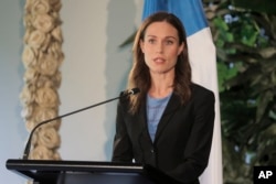 Perdana Menteri Finlandia Sanna Marin berpidato pada konferensi pers di Museum Auckland, di Auckland, Selandia Baru, Rabu, 30 November 2022. (Michael Craig/Selandia Baru Herald melalui AP)