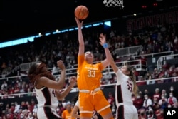 FILE - Tennessee guard Marta Suarez (33) shoots between Stanford forward Kiki Iriafen, left, and guard Hannah Jump during the first half of an NCAA college basketball game in Stanford, Calif., Sunday, Dec. 18, 2022. (AP Photo/Godofredo A. Vásquez)