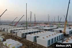 Workers build a large centralized quarantine facility capable of holding several thousand people in Shijiazhuang in northern China's Hebei Province on Jan. 16, 2021. (Xinhua News Agency via AP)