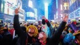 FILE - People celebrate as confetti flies around the countdown clock during the first public New Year's event at Times Square, in the Manhattan borough of New York City, Jan. 1, 2023. (REUTERS/Andrew Kelly)