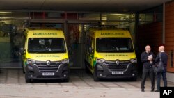 Ambulances are parked outside St Thomas' Hospital, in London, Dec. 1, 2022, amid a public sector strike over pay and working conditions.