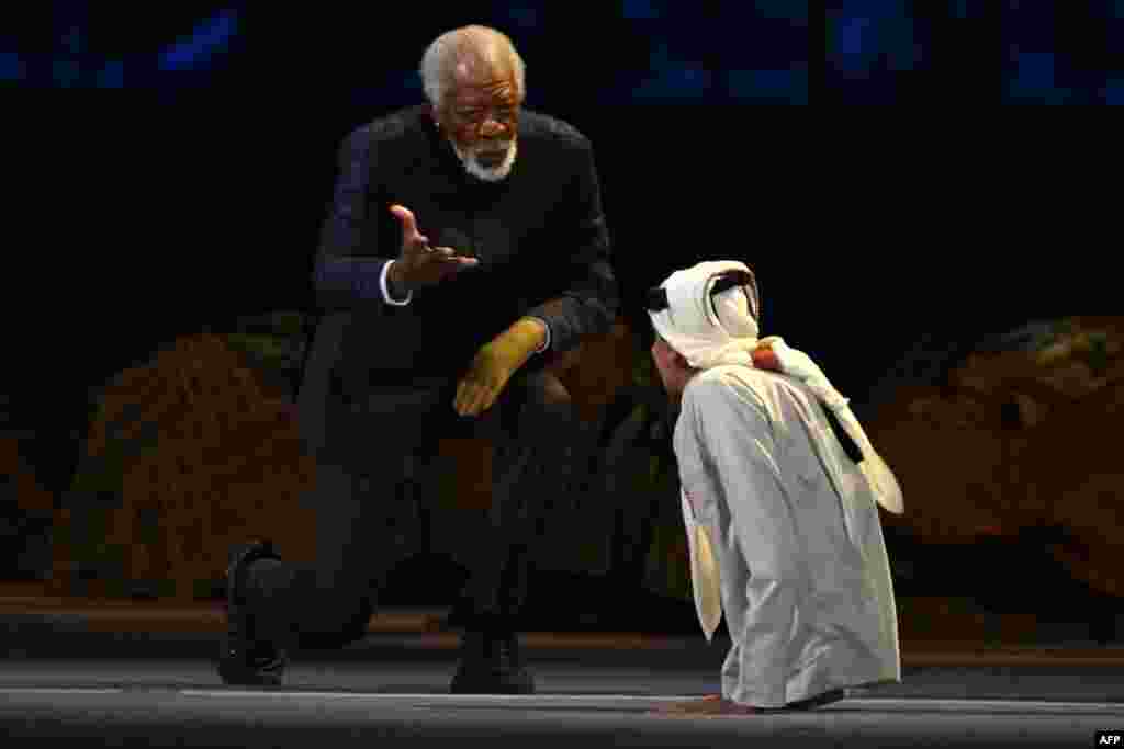 U.S. actor Morgan Freeman (L) and Qatari YouTuber Ghanim al-Muftah speak during the opening ceremony of the Qatar 2022 World Cup.&nbsp;