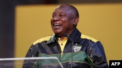 South Africa's President Cyril Ramaphosa laughs as he addresses Africa natinal Congress (ANC) delegates at the National Recreation Center (Nasrec) in Johannesburg on July 29, 2022. 