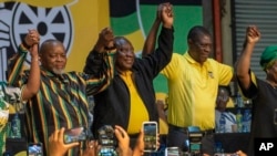 South African President Cyril Ramaphosa celebrates after being re-elected African National Congress president at the ANC national conference in Johannesburg, Dec. 19, 2022. 