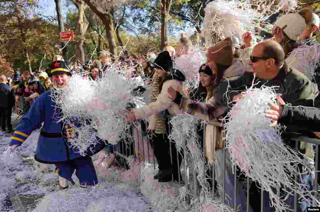 People attend the 96th Macy&#39;s Thanksgiving Day Parade in Manhattan, New York City.