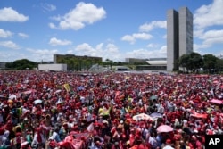 Supporters of Luiz Inacio Lula da Silva gather to attend his inauguration as new president outside the Planalto presidential palace in Brasilia, Brazil, Jan. 1, 2023.