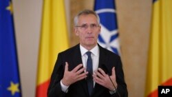 NATO Secretary-General Jens Stoltenberg speaks during joint statements with Romanian President Klaus Iohannis in Bucharest, Romania, Nov. 28, 2022, a day before the start of the meeting of NATO foreign ministers.