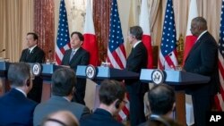 FILE - Japanese Defense Minister Yasukazu Hamada, Japanese Foreign Minister Yoshimasa Hayashi, U.S. Secretary of State Antony Blinken and U.S. Secretary of Defense Lloyd Austin speak during a news conference at the State Department, Jan. 11, 2023, in Washington.