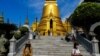 Tourists visit the Grand Palace in Bangkok, Thailand, Jan. 7, 2023. 