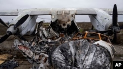 An aircraft that was destroyed during fighting between Ukrainian and Russian forces is seen at the Kherson international airport in Kherson, Ukraine, Dec. 2, 2022.