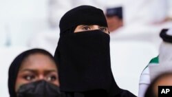 FILE - Saudi Arabian fans wait for the World Cup group C soccer match between Poland and Saudi Arabia, at the Education City Stadium in Al Rayyan , Qatar, Nov. 26, 2022.