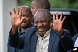 FILE - South African President Cyril Ramaphosa leaves an African National Congress (ANC) national executive committee in Johannesburg, South Africa, Dec. 5, 2022.