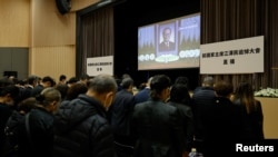 直播北京人民大会堂江泽民追悼会的一个香港会场。（路透社2022年12月6日）