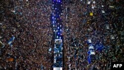 Argentina&#39;s soccer team is welcomed by fans&nbsp;after winning the Qatar 2022 World Cup tournament as they leave from Ezeiza International Airport to the Argentine Football Association training center in Ezeiza, Buenos Aires province.