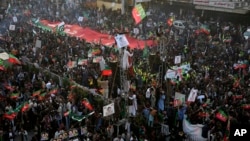 Supporters of Pakistan's former Prime Minister Imran Khan's 'Pakistan Tehreek-e-Insaf' party attend a rally, in Rawalpindi, Pakistan, Nov. 26, 2022.