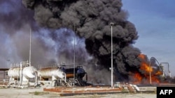 A handout picture released by Syria's General Organization of Radio and Television Telegram channel on Nov. 23, 2022, shows a fire at an unspecified hydrocarbon facility reportedly following a Turkish airstrike near Tal Awdah in northeastern Syria's Hasakah province.