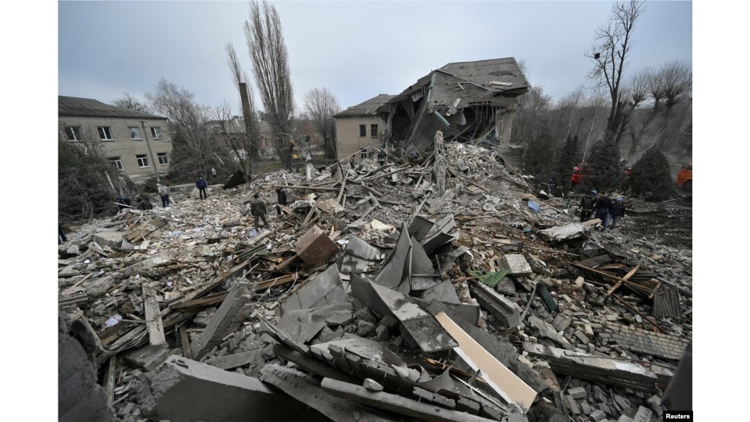 FILE - Rescuers work at the site of a maternity ward of a hospital destroyed by a Russian missile attack in Vilniansk, Zaporizhzhia region, Ukraine, Nov. 23, 2022.