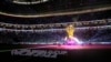 The World Cup Trophy is illuminated prior the World Cup, group A soccer match between Qatar and Ecuador at the Al Bayt Stadium in Al Khor, Nov. 20, 2022.