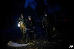 Elderly residents are evacuated from the southern city of Kherson, Ukraine, on November 27, 2022.