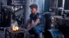 FILE - A young man sells heaters in the city of Raqqa, Nov. 11, 2022, amid a fuel crisis, as winter approaches in war-torn Syria.