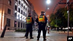 FILE - Police officers are seen in Budapest, Hungary, Nov. 11, 2020.