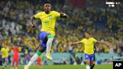 Vinicius Junior celebrates after scoring his side's opening goal during the World Cup round of 16 soccer match between Brazil and South Korea at the Stadium 974 in Doha, Qatar, Dec. 5, 2022.