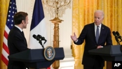 President Joe Biden speaks during a news conference with French President Emmanuel Macron in the East Room of the White House in Washington, Dec. 1, 2022.