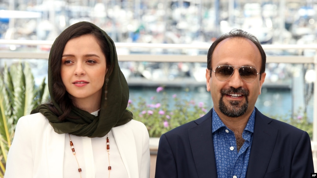 FILE - Actress Taraneh Alidoosti, left, and director Ashgar Farhadi pose for photographers at the Cannes Film Festival on May 21, 2016. Their film, "The Salesman," showed at the festival and won an Oscar for Best Foreign Language film in 2017. 