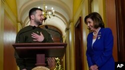 Ukraine's President Volodymyr Zelenskyy, left, meets with Speaker of the House Nancy Pelosi, Dec. 21, 2022, at the Capitol in Washington. 