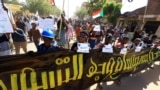 FILE: Protesters march against a framework deal that provides for a two-year civilian-led transition towards elections and would end a standoff triggered by a coup in October 2021, in Khartoum, Sudan, Dec. 5, 2022. 