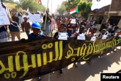 Protesters march against a framework deal that provides for a two-year civilian-led transition towards elections and would end a standoff triggered by a coup in October 2021, in Khartoum, Sudan, Dec. 5, 2022.