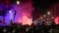 Moroccans gather to celebrate Morocco's win over Spain in a World Cup match played in Qatar, in Rabat, Dec. 6, 2022.