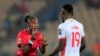 Referee Salima Mukansanga speaks to Guinea's Mamadou Kane at the Africa Cup of Nations Group B match at Stade Ahmadou Ahidjo, Yaounde, Cameroon, January 18, 2022.