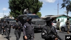 Police arrive in Soyapango, El Salvador, Dec. 3, 2022. The government of El Salvador sent 10,000 soldiers and police to seal off the community on the outskirts of the nation's capital Saturday to search for gang members. 