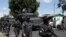 Police arrive in Soyapango, El Salvador, Dec. 3, 2022. The government of El Salvador sent 10,000 soldiers and police to seal off the community on the outskirts of the nation's capital Saturday to search for gang members. 