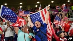 USA supporters cheer at the end of the World Cup, group B soccer match between the United States and Wales, at the Ahmad Bin Ali Stadium in Doha, Qatar, Nov. 22, 2022. The game ended in a 1-1 draw.