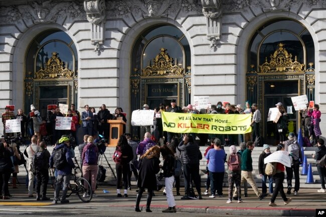 People take part in a demonstration about the use of robots by the San Francisco Police Department outside of City Hall in San Francisco, Monday, Dec. 5, 2022. (AP Photo/Jeff Chiu, File)