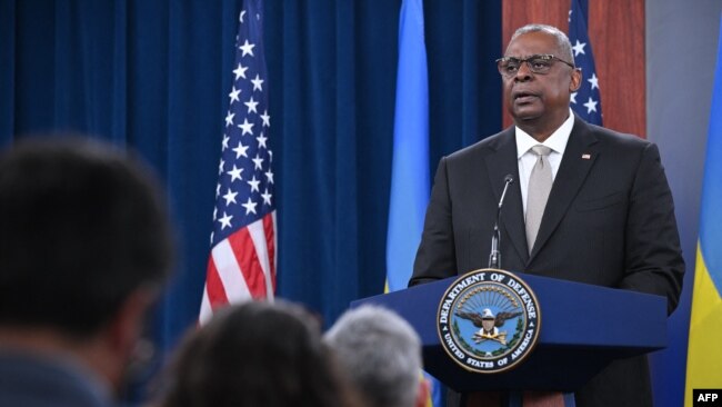 FILE - U.S. Defense Secretary Lloyd Austin speaks during a press conference at the Pentagon, near Washington, on Nov. 16, 2022. At a recent security forum in Canada, Austin warned that Beijing and Moscow seek a world