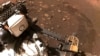 FILE - This March 4, 2021, NASA photo features the Perseverance rover on Mars. The rover happened to have its microphone on when a tower of red dust whirled overhead on Sept. 27, 2021, resulting in first-of-its-kind audio that scientists shared with the world on Dec. 13, 2022.