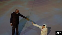 U.S. actor Morgan Freeman (L) and Qatari YouTuber Ghanim al Muftah attend the opening ceremony ahead of the Qatar 2022 World Cup Group at the Al-Bayt Stadium in Al Khor, north of Doha on November 20, 2022.