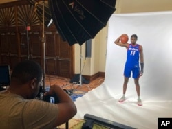 FILE - DePaul's Nick Ongenda, of Canada, poses for photos in Paradise Island, Bahamas, Nov. 19, 2022. (AP Photo/Aaron Beard)