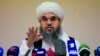 FILE - Taliban official Shahabuddin Dilawar gestures during a news conference in Moscow, Russia, July 9, 2021. Now the group's mining minister, Daliwar has hailed an investment deal it closed with China on the extraction of oil in northern Afghanistan.