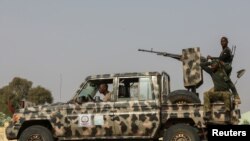 FILE - Security forces are seen on patrol in Nigeria's Zamfara state, March 3, 2021