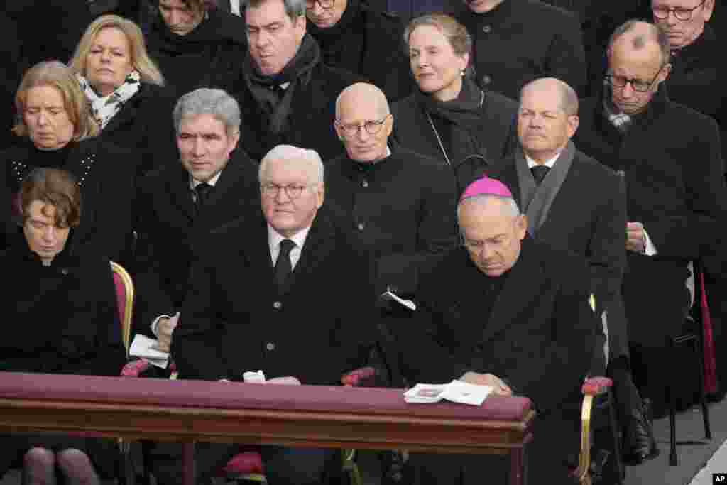 German President Frank-Walter Steinmeier, center, and German Chancellor Olaf Scholz, 3rd right, attend the funeral of late Pope Benedict XVI in St. Peter&#39;s Square at the Vatican, Jan. 5, 2023.