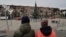 Local citizens walk near a Christmas tree decorated for Orthodox Christmas and the New Year festivities in Mariupol, in Russian-controlled Donetsk region, eastern Ukraine, Jan. 5, 2023.
