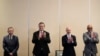 From left, Venezuelan opposition delegate Gerardo Blyde Perez, Mexico Foreign Minter Marcelo Ebrad, Norwegian diplomat Dag Nylander and President of the National Assembly of Venezuela, Jorge Rodriguez, applaud after agreeing to create a U.N.-managed fund to aid Venezuela's poor.