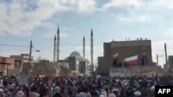 FILE - This image grab from a UGC video made available Dec. 9, 2022, reportedly shows protesters marching after Friday prayers, in Zahedan, Iran. 