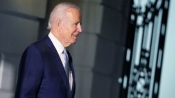 FILE - U.S. President Joe Biden walks to board Marine One on the South Lawn of the White House in Washington, Jan. 6, 2022.